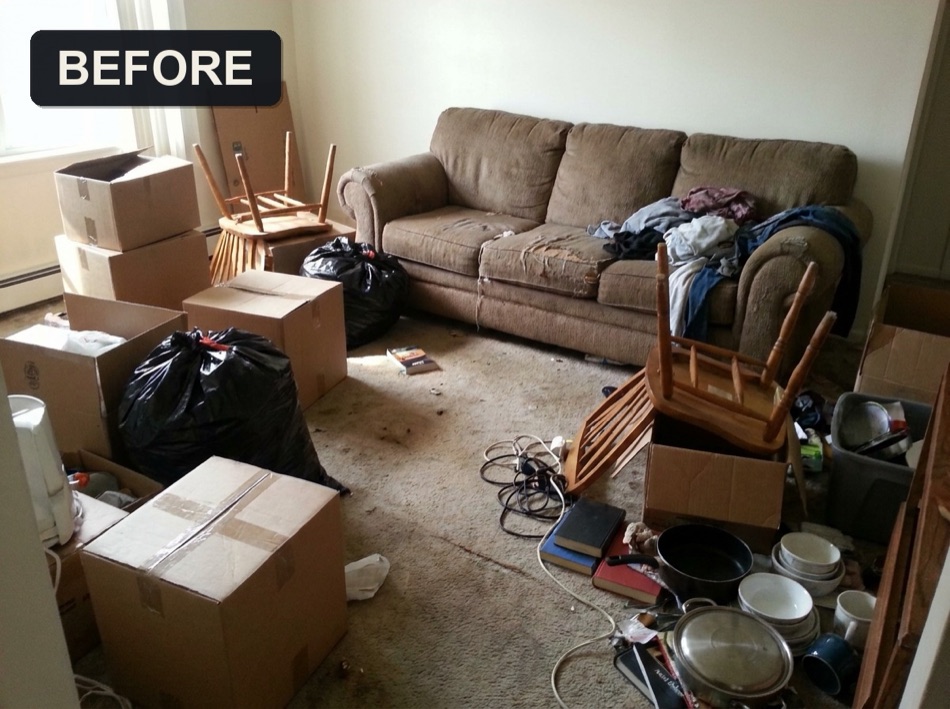 Living room full of junk during a move-out, before