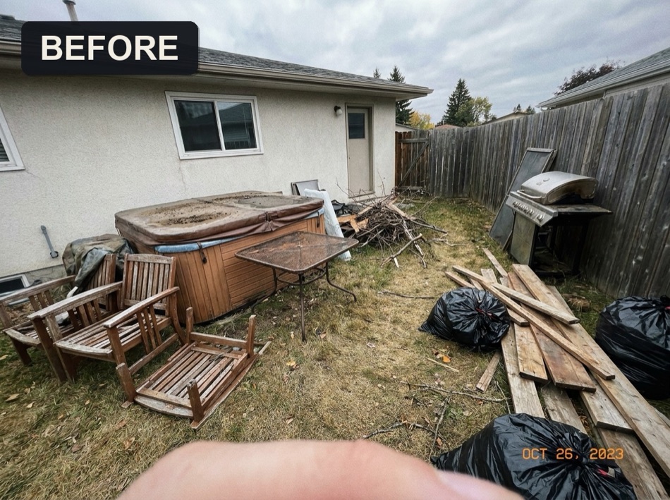 Backyard full of junk, hot tub and debris, before